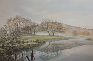 This is a signed limited edition print of an original soft pastel painting by artist Michael Howley. The subject of the painting is a calm wide view across Lake Elterwater as the mists of dawn clear. The sky is a pastel shade of blue with soft white and pink clouds. The distant peach coloured hills are reflected in the still waters along with bare trees of early spring. To the left is the soft green foreground banking with 2 small figures walking into the mist. A dark shape of broken fencing adds focus to the foreground.