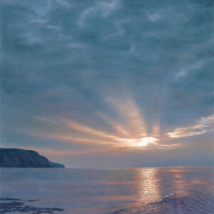 This is a signed limited edition print of an original soft pastel painting by artist Michael Howley. The subject of the painting is an atmospheric evening seascape of Boulby Cliffs from Staithes. It shows a low sunburst over the sea with softly broken blue-grey clouds above and a headland to the left. The blue-greys, pastel reds and white are reflected in the broken surface of the water.