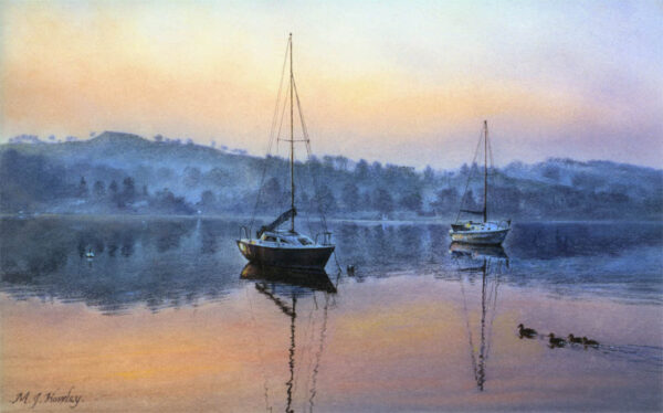 This is a signed limited edition print of an original soft pastel painting by artist Michael Howley. The subject of the painting is two boats in the warm pink light of dawn against the blue hills surrounding Lake Windermere.