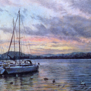 This is a signed limited edition print of an original soft pastel painting by artist Michael Howley. The subject of the painting is boats moored on Windermere set against an evening sky with soft grey clouds and pastel colours of blue and pink which are reflected in the ripples of the Lake.