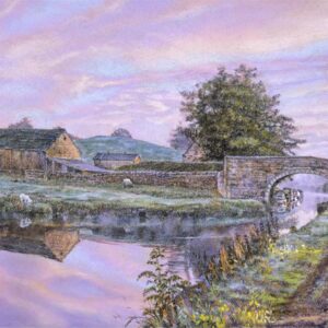 This is a signed limited edition print of an original soft pastel painting by artist Michael Howley. The subject of the painting is a figure strolling along the canal path towards a bridge and farmhouse. It is a bright morning with pastel shades of blue and pink in the sky, reflected in the canal. There is a slight frost on the ground.