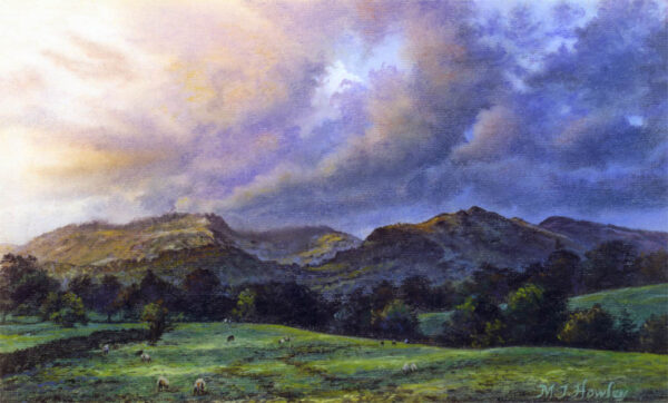 This is a signed limited edition print from an original soft pastel painting by artist Michael Howley. A scene across fields to the Langdales beyond with a rolling evening sky of clouds in blues, purples and pinks. The evening light casts shadows across the distant hills and foreground fields and there is a general sense of movement.