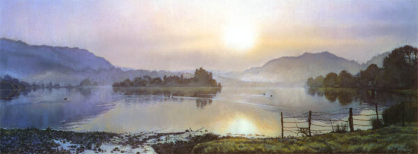 This is a signed limited edition print from an original soft pastel painting by artist Michael Howley. A misty sunrise pervades this panoramic lakeland scene with the warm glow of sunrise reflected in the lake. The sky goes from pastel blues and pinky purples to soft red-oranges, all of which are reflected in the water. Distant hills are blue-grey and the islands and land masses form a dark silhouetted contrast.