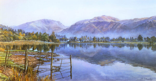 This is a signed limited edition print from an original soft pastel painting by artist Michael Howley. With a clear blue sky and cool blue reflections, this is a scene across Lake Grasmere with 2 swans on the grassy bank. There is low mist at the foot of the distant hills which are coloured in soft blues, purples and pinks.