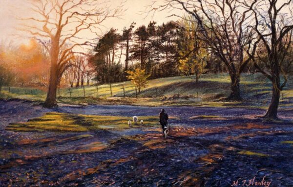 This is a signed limited edition print from an original soft pastel painting by artist Michael Howley. Sunlight glows through trees as a farmer and his dog shepherd sheep and lambs home along the banks of Derwentwater. Colours range from warm reds and oranges from the sun to cool blue shadows in the foreground.